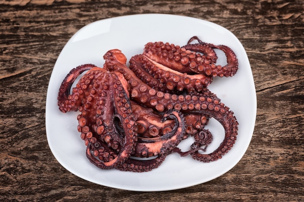 Red boiled octopus plate. The texture on the table.