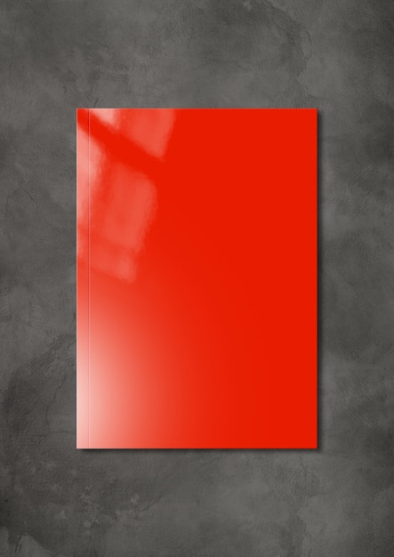 Red booklet cover isolated on dark concrete background, mockup template