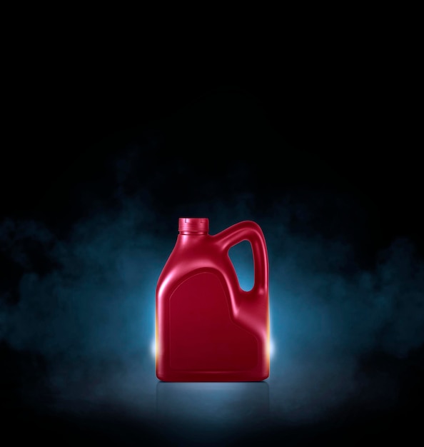 Photo red bottle of engine oil on black background with smoke