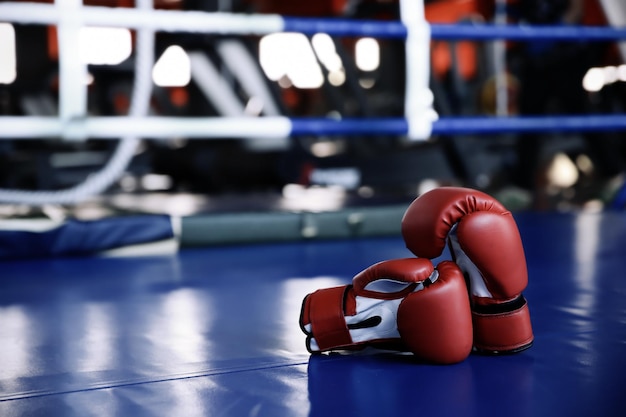 Red boxing gloves on ring