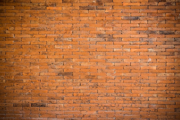 Foto fondo e struttura rossi del muro di mattoni