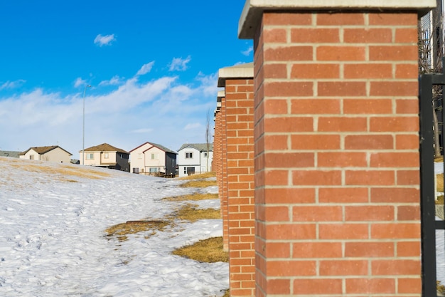 Red Brick Wall beside a snow covered field