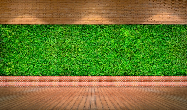 Red brick wall with fresh green grass background