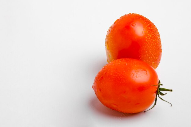 Red, bright, juicy, fresh tomatoes isolated