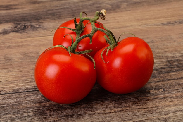 Red bright ripe tomato branch