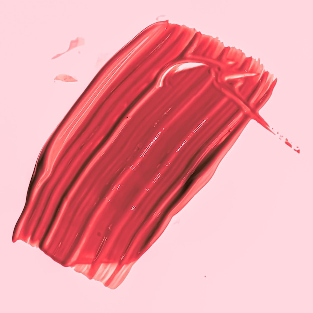 Фото Красный мазок кистью или макияж крупным планом, косметика и текстура губной помады