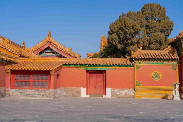 A red building with a chinese symbol on the front