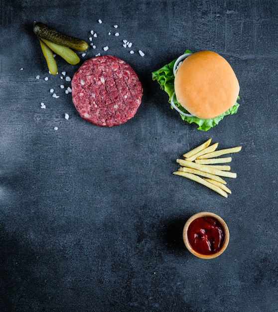 Red burger meat closeup on black background