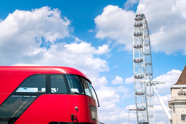 Red bus public transportation in London with London Eye London Great Britain United Kingdom