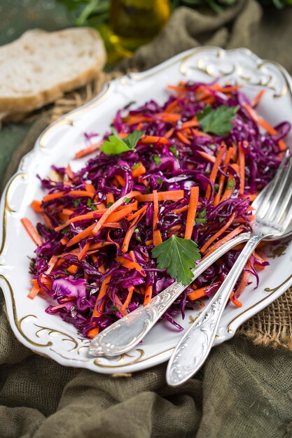 Red cabbage coleslaw salad with carrots with a dressing of olive oil and lemon