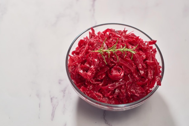 Red cabbage sauerkraut served in a glass bowl