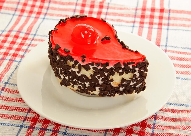 Red cake with chocolate and jelly on a dish