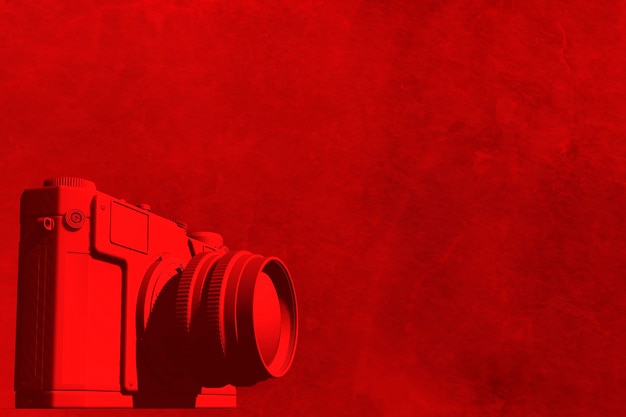 Red camera on red background with golden sparkles 3d illustration