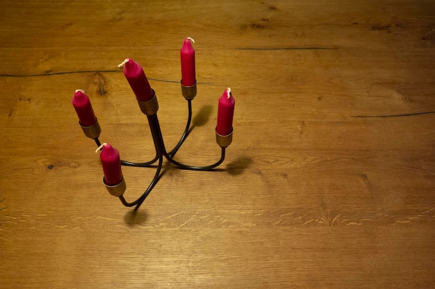 Photo red candle sticks on top of wood table background