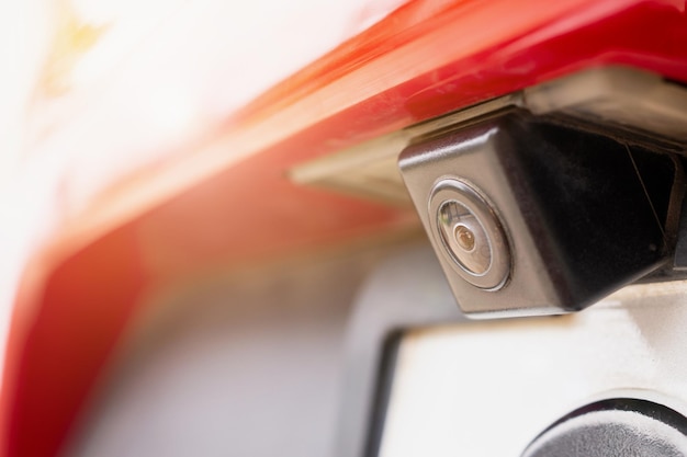 Red car rear view camera close up for parking assistance