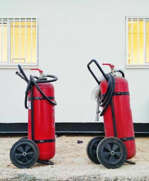 Photo red cart of fire extinguisher