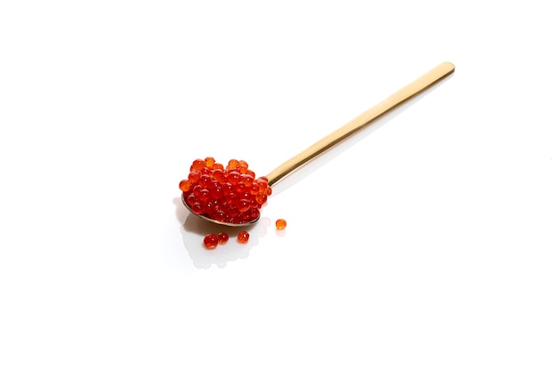 Red caviar on white isolated