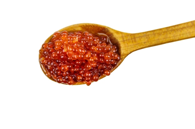 Red caviar in wooden spoon isolated on white background