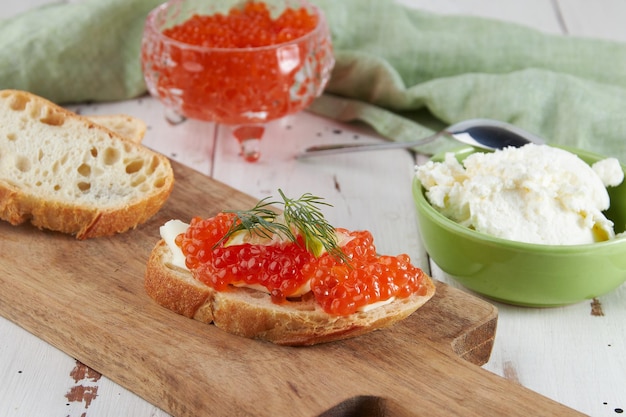 Red caviar on a wooden table bruschetta with caviar