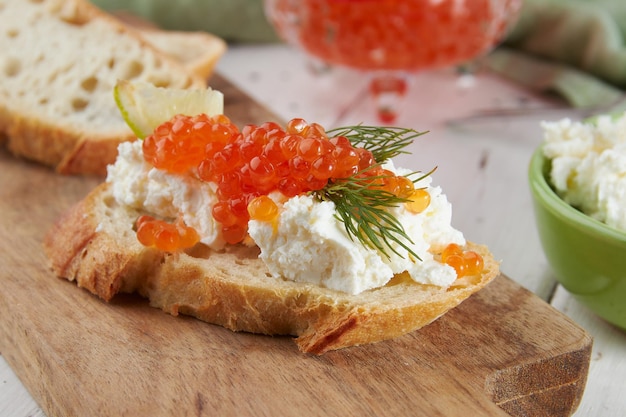 Red caviar on a wooden table bruschetta with caviar