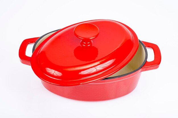 Red ceramic cast iron casserole dish. Studio Photo.
