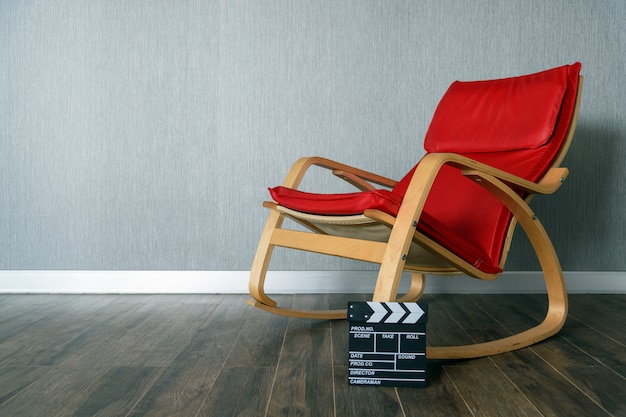 Red chair and clapperboard with space for text