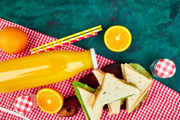 Red checked tablecloth, basket, healthy food