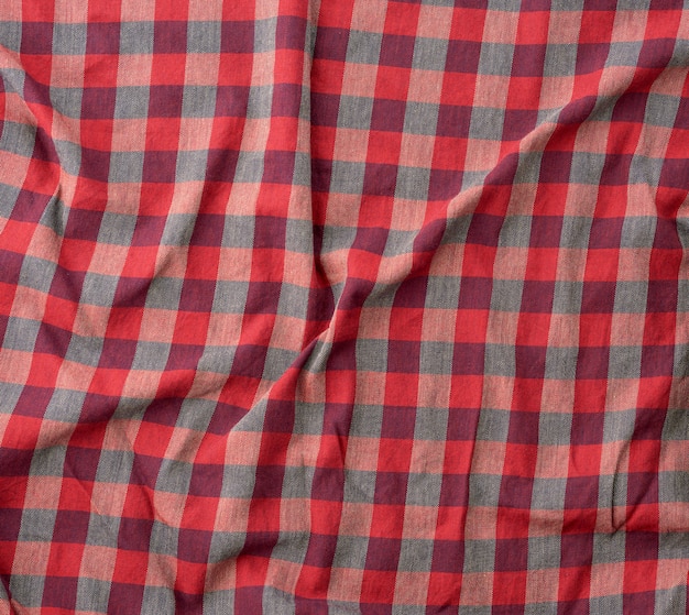 Photo red checkered fabric for sewing various clothes with waves