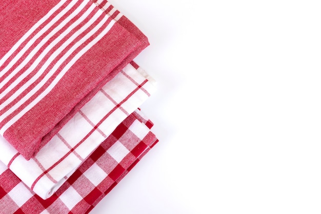 Photo red checkered gingham kitchen towels top view on white with copy space