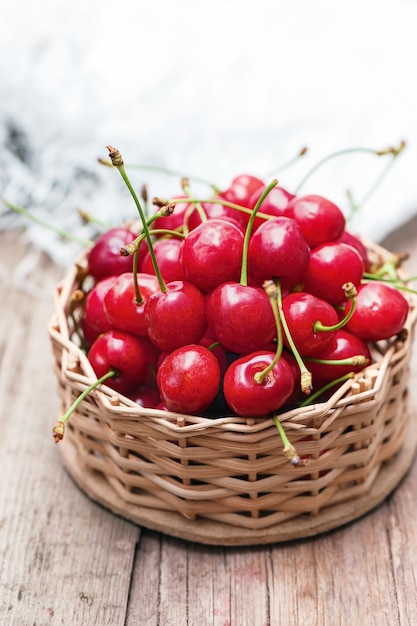 Red cherries on wooden table