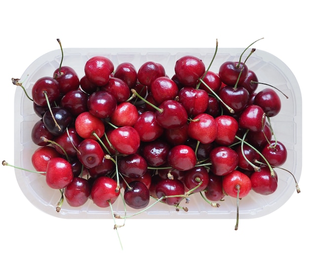 Red cherry basket isolated over white