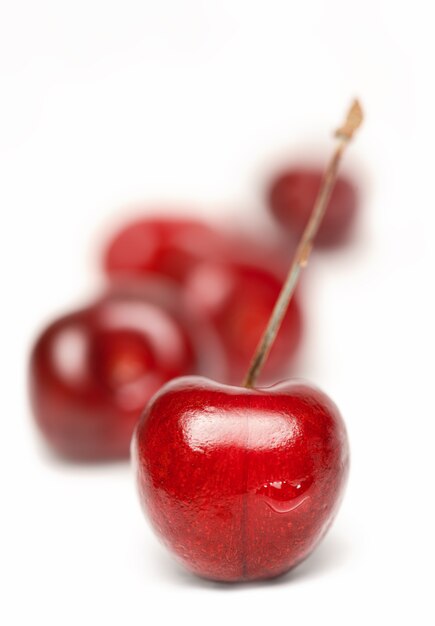 Red cherry berries on a white background