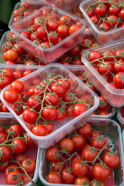 Red cherry tomatoes on market stall