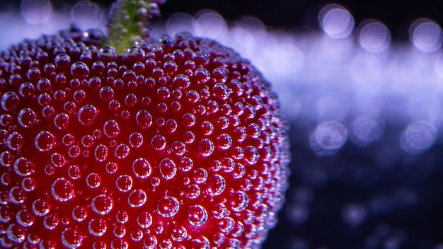 red cherry with bubbles in soda