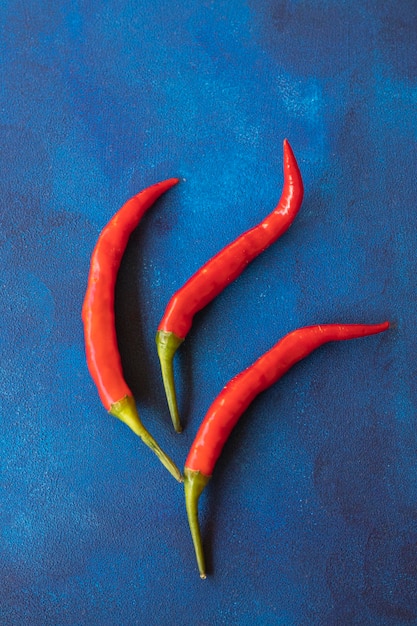 red chili pepper on abstract background blue brown deco vege health diet