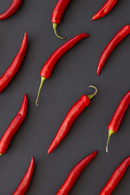 Red chili pepper on black background