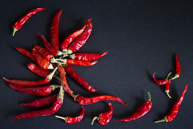 Red chili pepper on a black background