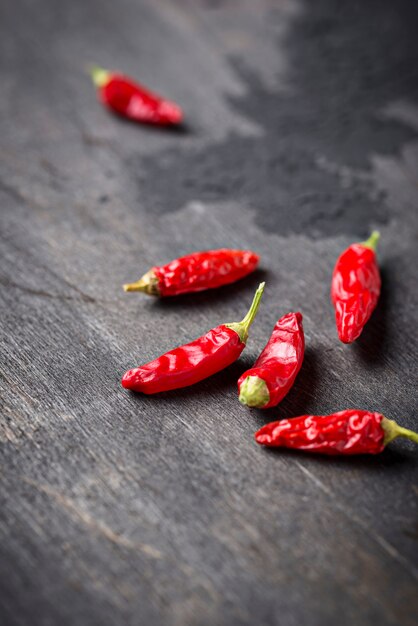 Red chili pepper on dark background