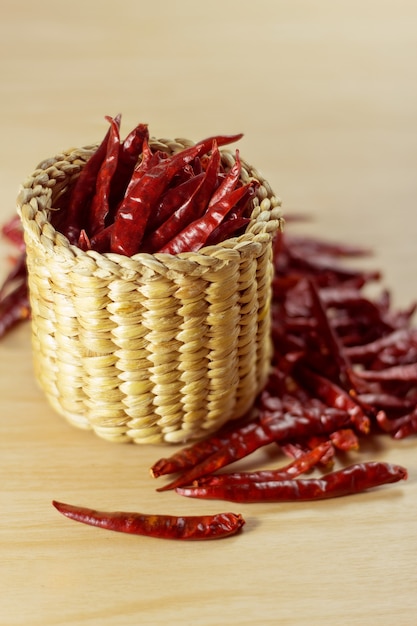 Red chili pepper dried chillies on wood background