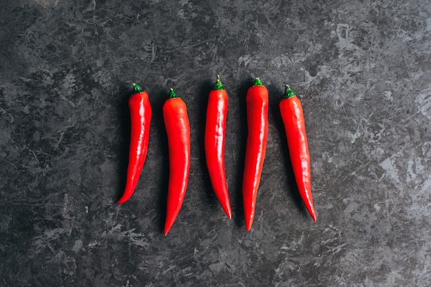 Red chili pepper isolated on black background