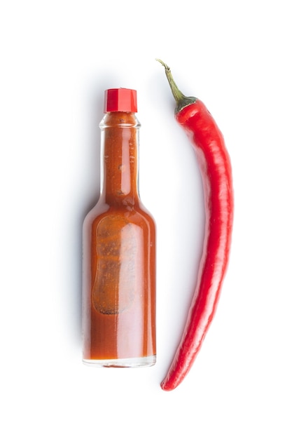 red chili pepper and tabasco sauce isolated on white background