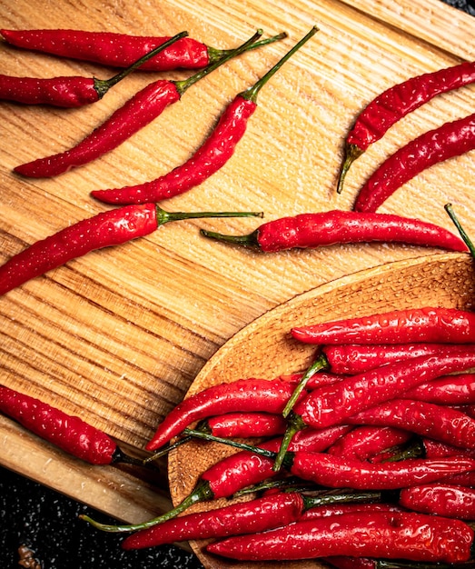 Red chili peppers on a cutting board