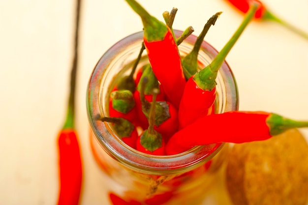 Red chili peppers on a glass jar