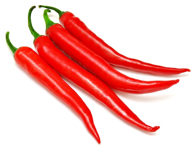 Red chili peppers isolated on a white background. Top view, flat