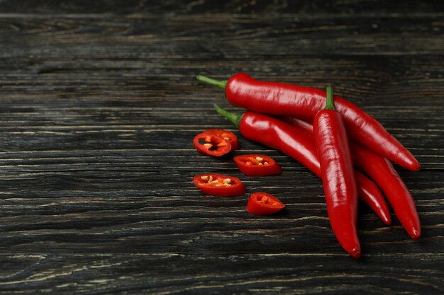 Red chili peppers on rustic wooden