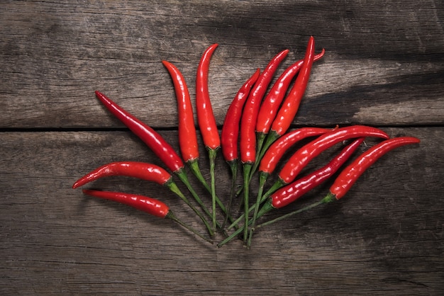 Red chilli on dark wooden table background. food concept