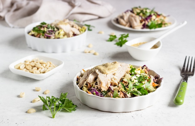 Red and chinese cabbage, carrot salad with roasted turkey