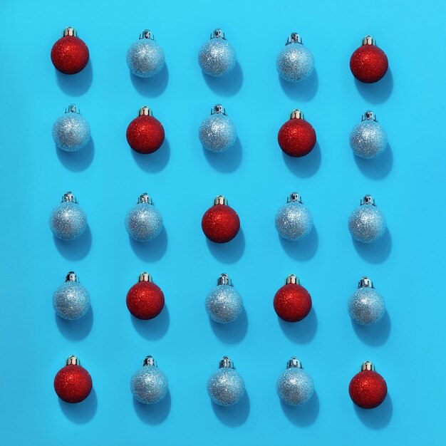 Red christmas ball among blue balls. personality concept