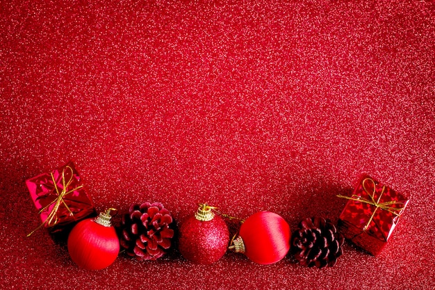 Photo red christmas ball and gift decoration glitter background