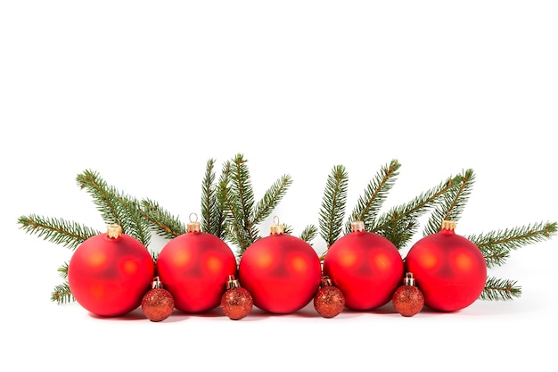 Red Christmas balls and fir branch